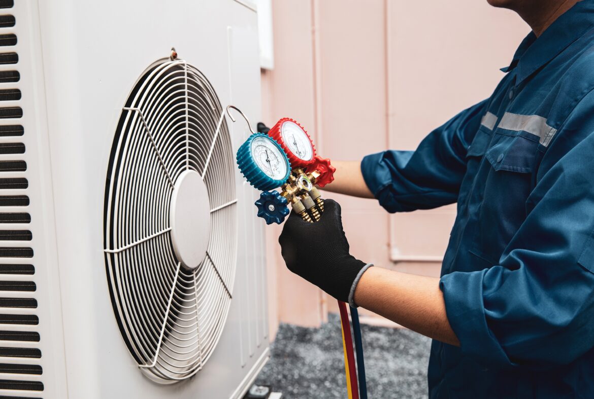 hvac-worker-with-gauges
