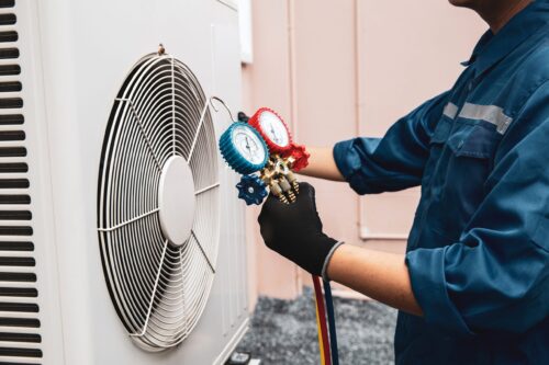 hvac-worker-with-gauges